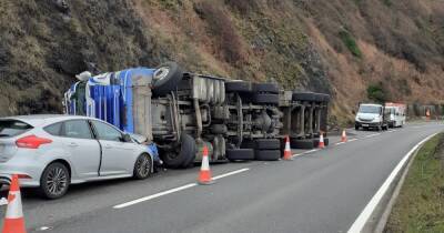 Lorry overturns after crashing with car on Scots road as driver taken to hospital - www.dailyrecord.co.uk - Scotland - Beyond