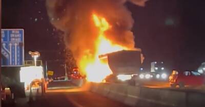 Video shows horror blaze after four-vehicle smash that has brought motorway to a standstill during rush hour - www.manchestereveningnews.co.uk - Manchester