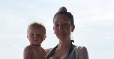 Katherine Ryan stuns in green swimsuit as she cuddles baby son on family holiday - www.ok.co.uk