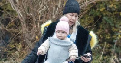 Kate Lawler has her hands full on winter walk with baby daughter Noa and two dogs - www.ok.co.uk