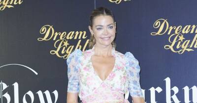 Denise Richards ripped for wearing coat over her head rather than mask on airplane - www.wonderwall.com