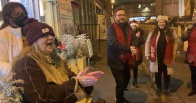 Watch as Janey Godley surprises deli owner pal with amazing festive flash mob - www.dailyrecord.co.uk - Scotland - Choir
