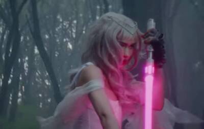Watch Grimes’ lightsaber-wielding video for ‘Player Of Games’ - www.nme.com