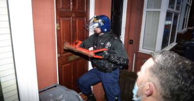 Dozens of GMP officers smash into homes and arrest 14 in major Christmas crackdown - www.manchestereveningnews.co.uk - Manchester