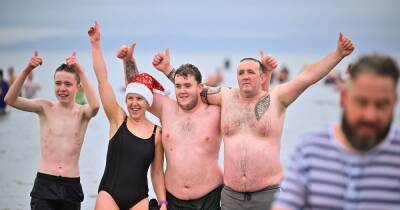 Boxing Day swimmers pack Ayr beach for sea dip in freezing weather conditions - www.dailyrecord.co.uk - Scotland