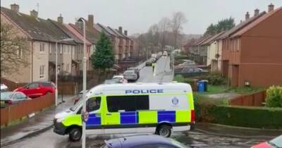 Cops block off Scots street with riot vans as 'officers search gardens' - www.dailyrecord.co.uk - Scotland