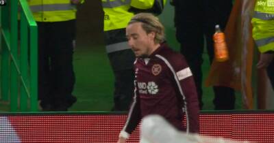 Barrie McKay struck by bottle from Celtic Park home end as Hearts star takes corner - www.dailyrecord.co.uk