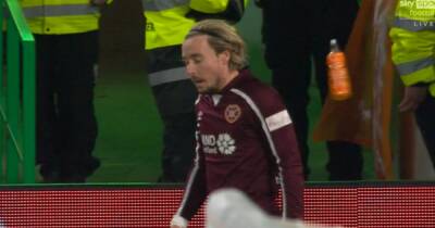 Man arrested after Hearts star Barrie Mackay hit by bottle during Celtic clash - www.dailyrecord.co.uk