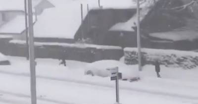 'Gimme my f**king money!' Scots mum and son scream and fight in street rammy before he tackles her to ground in snow - www.dailyrecord.co.uk - Scotland