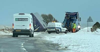 Driver rushed to hospital after double-decker bus ends up on its side as bad weather causes A90 crash - www.dailyrecord.co.uk - Scotland