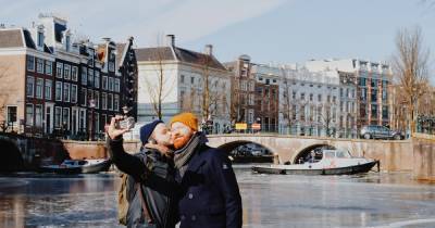 Winter in Amsterdam: Skating on Frozen Canals - coupleofmen.com - city Amsterdam