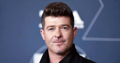 Robin Thicke Says He Is a ‘Total Believer’ in Going to Therapy With Fiancee April Love Geary and Ex-Wife Paula Patton - www.usmagazine.com