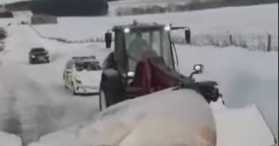 Scots farmer tows cops up road in tractor after car got stuck in snow - www.dailyrecord.co.uk - Scotland