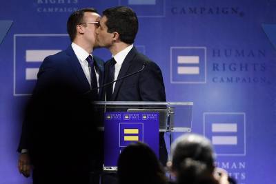 Chasten Buttigieg posts picture of him and husband Pete kissing on day Rush Limbaugh dies - www.metroweekly.com - USA