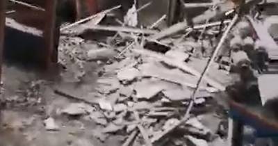 Shocking video shows aftermath of roof collapse at motorbike garage - www.manchestereveningnews.co.uk