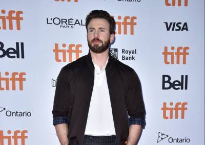 Chris Evans Adorably Fixes His Dog Dodger’s Toy While The Pup Gets Hip Surgery - etcanada.com