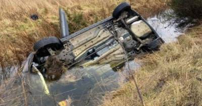 Car flips onto roof and lands in water-filled ditch in horror crash - www.dailyrecord.co.uk - Scotland