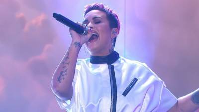 Demi Lovato Says She Cut Her Hair Off After Using It to Cover Her Body - www.etonline.com