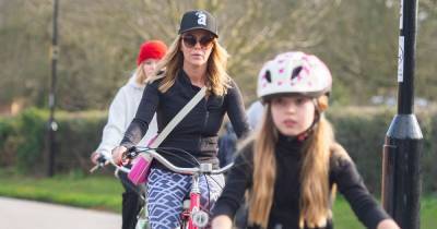 Amanda Holden appears in deep thought while on family bike ride with daughters after lockdown rule break - www.ok.co.uk - Britain