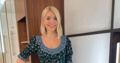 Holly Willoughby shows of curvaceous figure in playful floral dress on This Morning - copy her look here - www.ok.co.uk