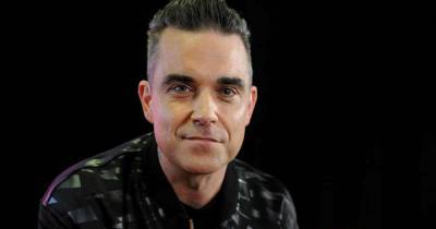 Robbie Williams biopic in the works from Greatest Showman director - www.msn.com