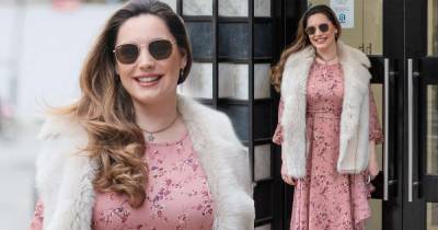 Kelly Brook catches the eye in a pink floral dress and burgundy boots - www.msn.com
