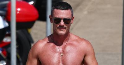 Luke Evans Shows Off New Leg Tattoo in Tiny Bathing Suit During Trip to the Beach! - www.justjared.com - Australia
