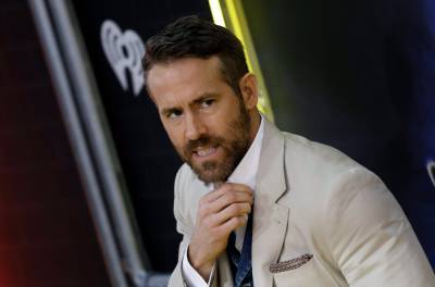 Ryan Reynolds Uses Hugh Jackman’s Face As Motivation To Learn Axe Throwing - etcanada.com