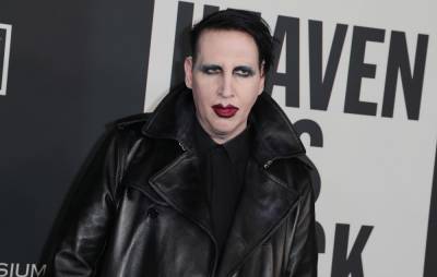 Marilyn Manson allegedly “forced female fans to strip” after inviting them on his tour bus - www.nme.com