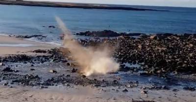 Footage shows two wartime ‘bombs’ washed up on Scots beaches in just 24 hours destroyed in controlled explosion - www.dailyrecord.co.uk - Scotland