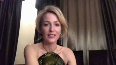 Gillian Anderson Reveals the One Thing She Wishes She Had While Watching Golden Globes From Prague (Exclusive) - www.etonline.com - city Prague