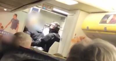 Scots Ryanair passenger headbutted flight attendant and made fascist salute after downing bottle of vodka in Tenerife flight rampage - www.dailyrecord.co.uk - Scotland - Italy - Manchester