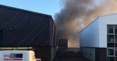 Emergency services on scene after massive tyre fire at Scots garage sends plumes of smoke into the sky - www.dailyrecord.co.uk - Scotland