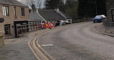 Car flips over barrier and smashes into house as Scots cops race to scene - www.dailyrecord.co.uk - Scotland