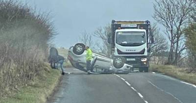 Car flips onto roof in horror crash amid ongoing incident on Scots road - www.dailyrecord.co.uk - Scotland