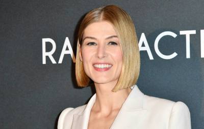 Rosamund Pike buries her awards in the garden: “It’s probably deeply psychological” - www.nme.com - city Prague