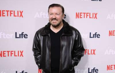 Ricky Gervais shares picture getting his first COVID jab - www.nme.com