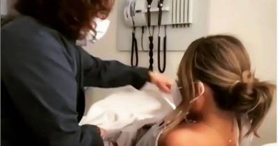 Chrissy Teigen takes video call with 'really important people' during medical examination - www.manchestereveningnews.co.uk