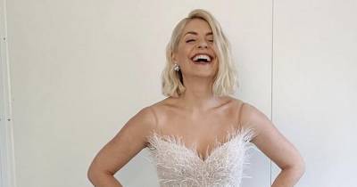 Holly Willoughby wows in a white strapless dress with feather and sequin detailing for the Dancing On Ice final - www.ok.co.uk