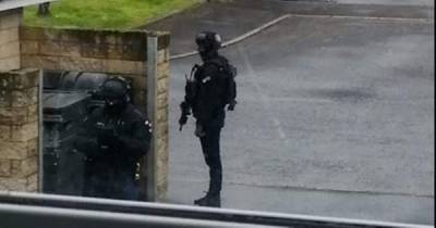 Cops continue to comb Livingston property after armed police swoop on street - www.dailyrecord.co.uk - Scotland - county Livingston