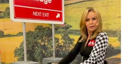 Amanda Holden wows fans in plunging jumpsuit as she dresses as sexy Formula One race car driver - www.ok.co.uk - Britain