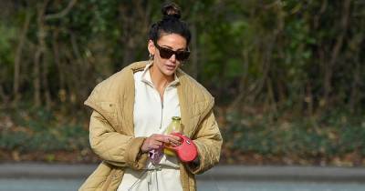 Michelle Keegan stuns in a chic padded coat and cream tracksuit as she takes pet pooches for a walk - www.ok.co.uk