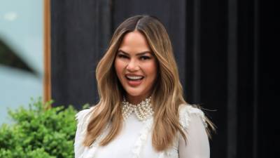 Chrissy Teigen's Reaction to Her Son Interrupting a ‘Thirsty’ Topless Snap Is So Good - www.glamour.com