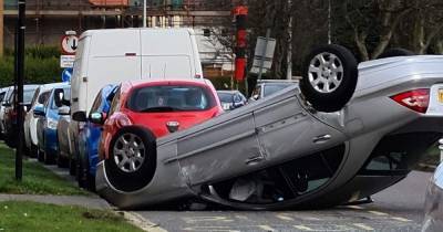 Scots motorists have lucky escape after vehicle flips onto roof on residential street - www.dailyrecord.co.uk - Scotland