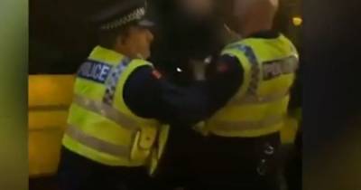 Police launch internal investigation after student 'grabbed by throat for shaking his head' following protest - www.manchestereveningnews.co.uk - Manchester