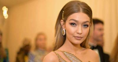 Gigi Hadid steps out with baby Khai in a blue trench coat everyone needs for spring - www.msn.com - New York