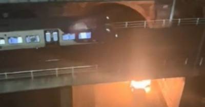 Car engulfed by flames after 'explosion' beneath railway line in Manchester city centre - www.manchestereveningnews.co.uk - Manchester