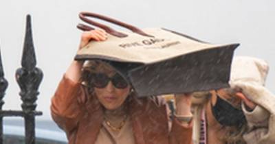 Rachel Stevens turns £945 designer bag into an umbrella as she gets a soaking in sudden downpour - www.ok.co.uk