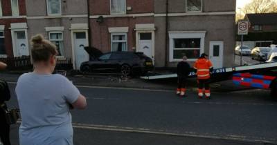 Car crash sends Audi through garden wall and just inches from young family's front room - www.manchestereveningnews.co.uk - Manchester