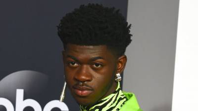 Lil Nas X Raises Hell With ‘Satan Shoes’ as Nike Files Lawsuit Against Designer - variety.com